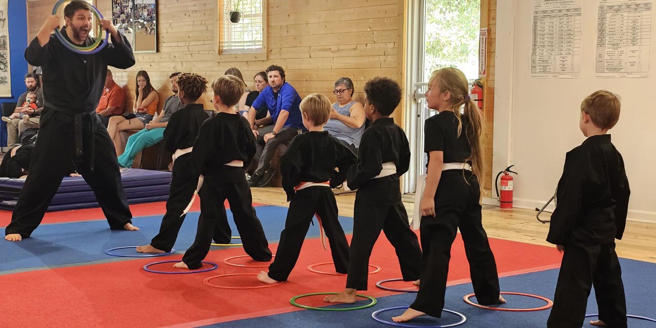 Young Kuk Sool martial arts students line up for instruction