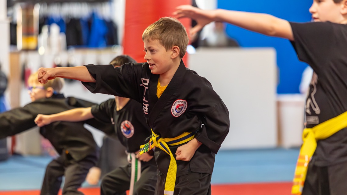 Young Kuk Sool martial arts students practice punching